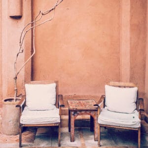 hand carved wooden chairs and side table