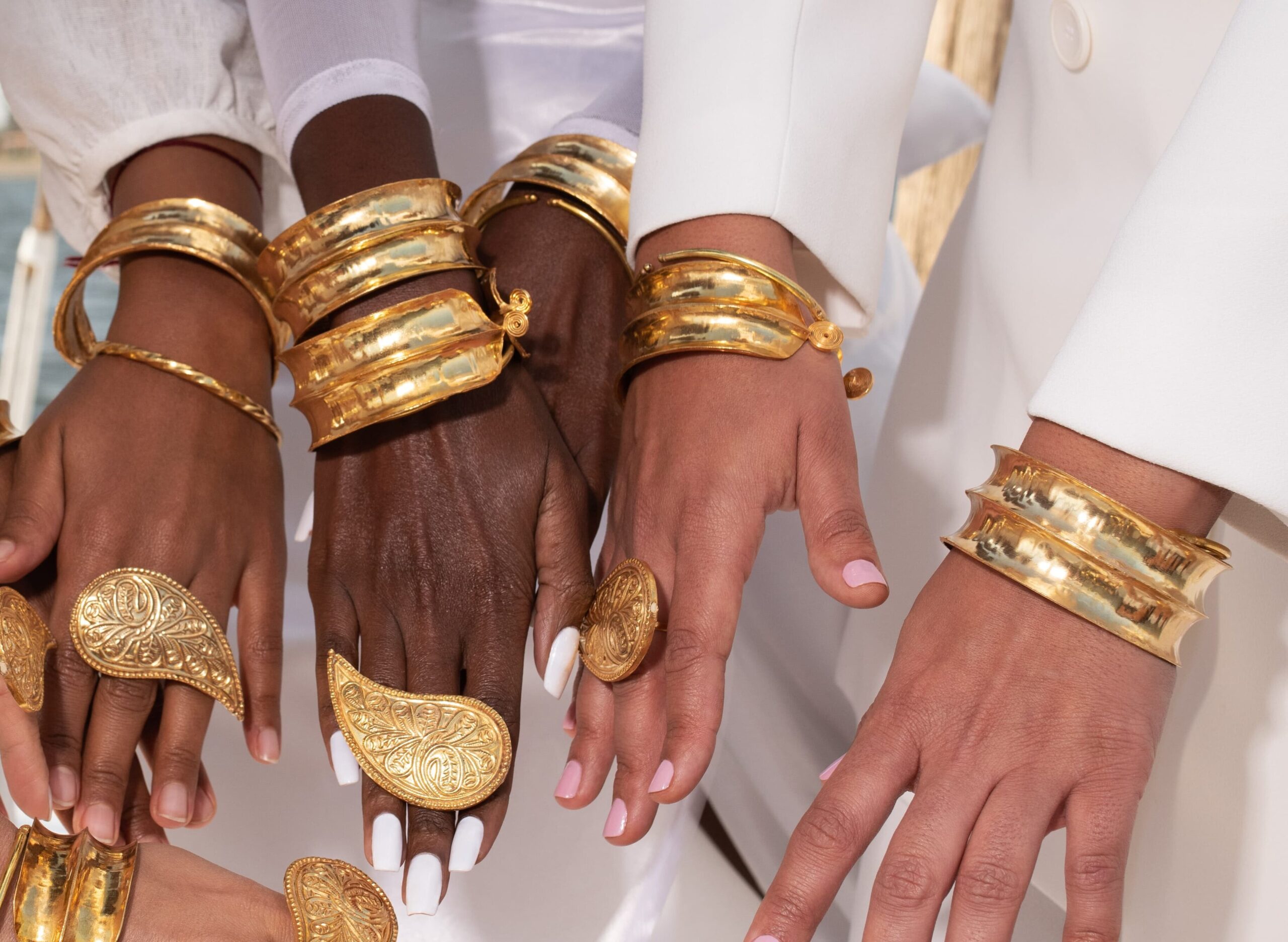 hand with gold cuff and ring