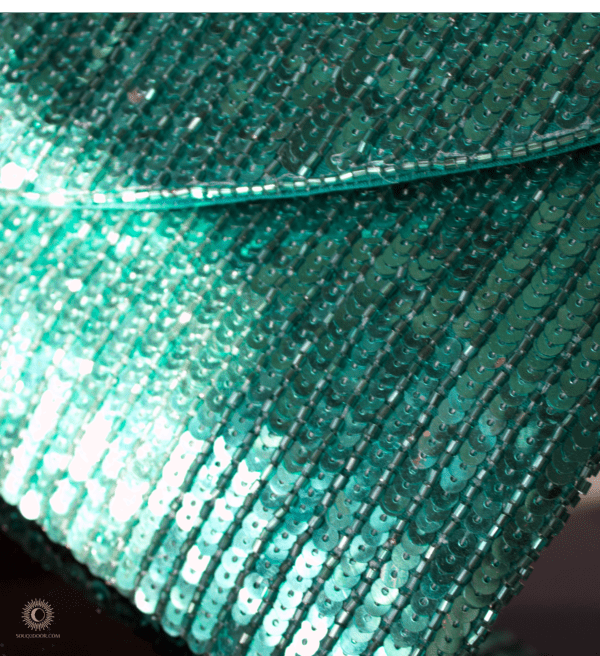Close up of beading on emerald green purse