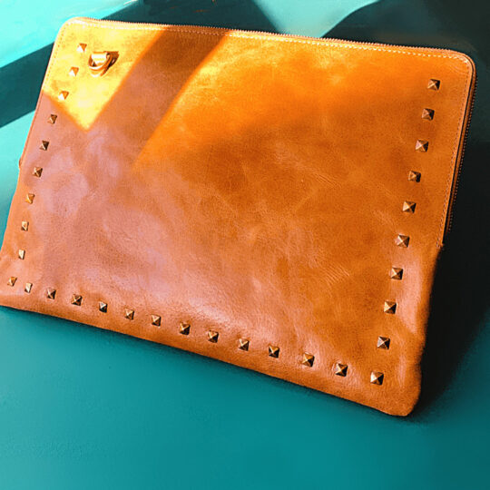 Leather laptop bag with studs