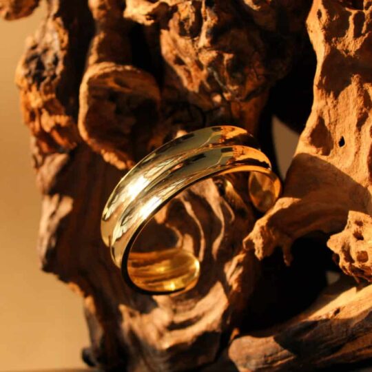 Side view of gold and silver cuff bracelet