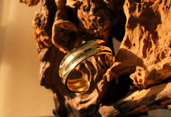 Side view of gold and silver cuff bracelet