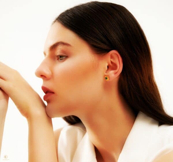 Lab grown emerald earrings wore by model