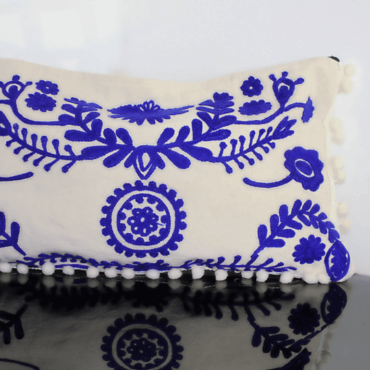 White clutch with embroidered royal blue details
