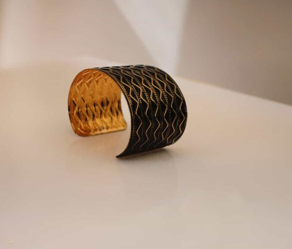 black and brass wrist cuff