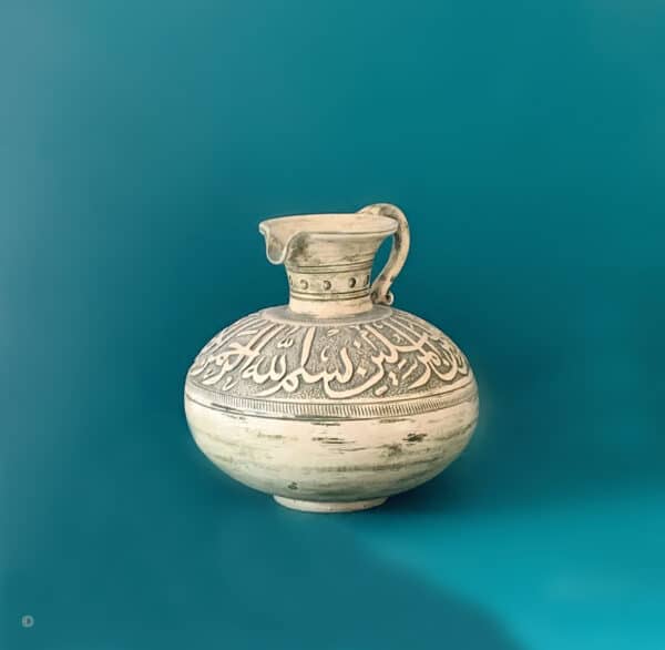 Arabic pottery jug with calligraphy olive green and cream