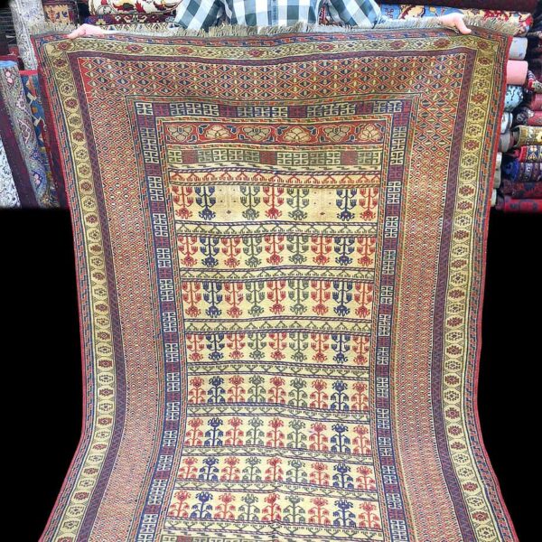 Rug from Afghanistan - Afghani Sumac rug made by the Baluchi's the rug is warm brown and cream.