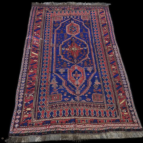Baluch Kilim Rug or a Baluchi Rug from Afghanistan, the shades are vibrant blue and are set against a black background.
