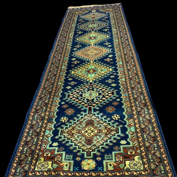 Qashqai Rug long made in Afghanistan made with silk and wool this is a tribal rug in vibrant navy, turquoise, saffron and cream.