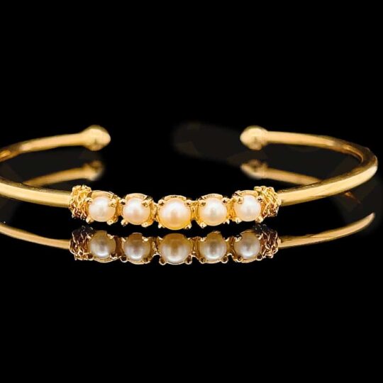 Gold Cuff Bracelet with Bahraini Pearls contains 5 pearls from Bahrain and the cuff is made from gold.