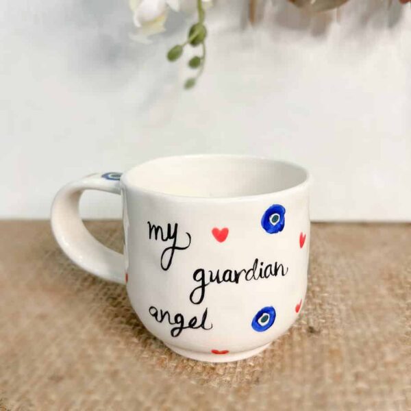 Handmade Ceramic Mug mug has my guardian angel painted on the front.