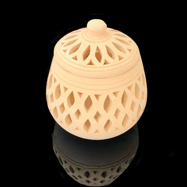 Large pottery candle holder, it has carved cut outs