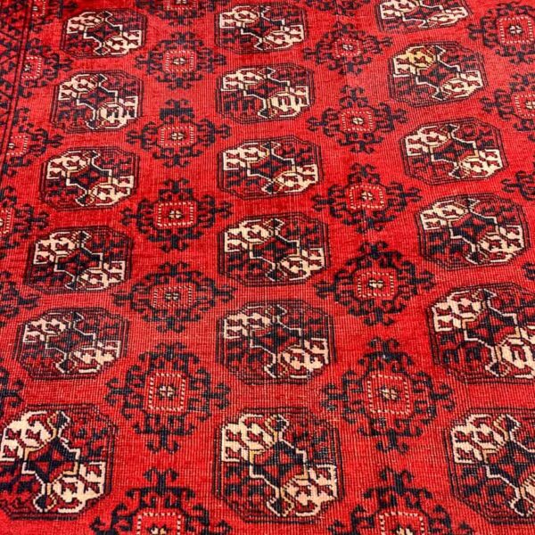 Large Red Area Rug which is vintage it is a Turkmen tribal area rug.