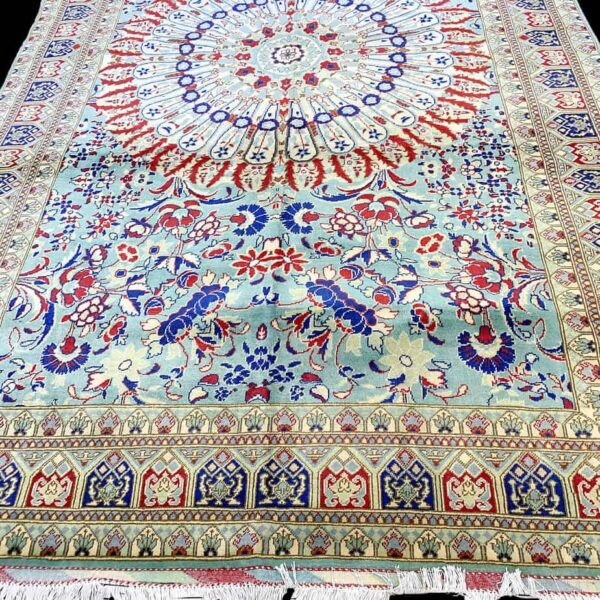Large rug from Afghanistan handmade by the Meronous family.