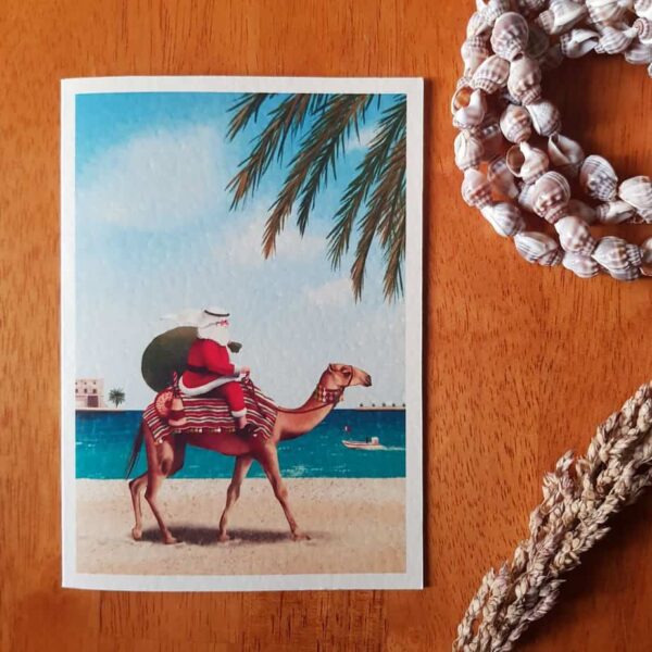 Unique handmade water colour Christmas cards this unique card shows Santa on a camel in a beach setting