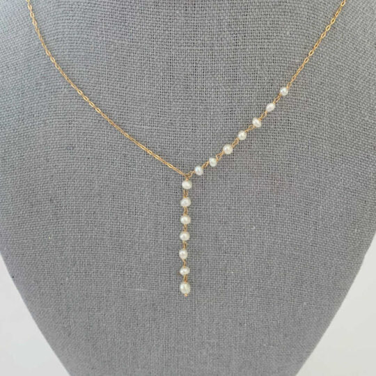 Gold and pearl modern necklace contains pearls from Bahrain.