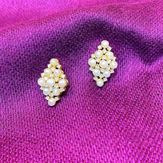 Pearl cluster earrings on vibrant pink fabric, elegant jewelry for women, handmade accessories, perfect for special occasions or everyday wear.