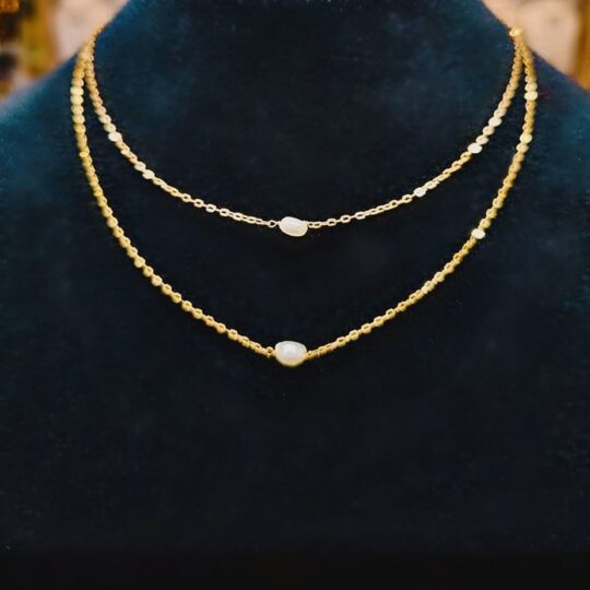 Layered gold chain necklace with pearls