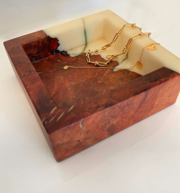 Beautiful marble and wood jewellery tray showcasing gold necklaces and bracelets, perfect for organising accessories in style.