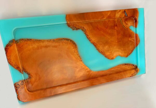 Stylish wooden and resin serving tray featuring a contemporary design, ideal for serving food and drinks or as a decorative piece. Made from durable materials, it adds a touch of elegance to any home.