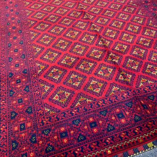 deep red tribal rug, handmade in Afghanistan.