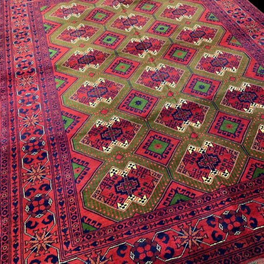 handwoven, hand knotted area rug from Afghanistan with tribal patterns.