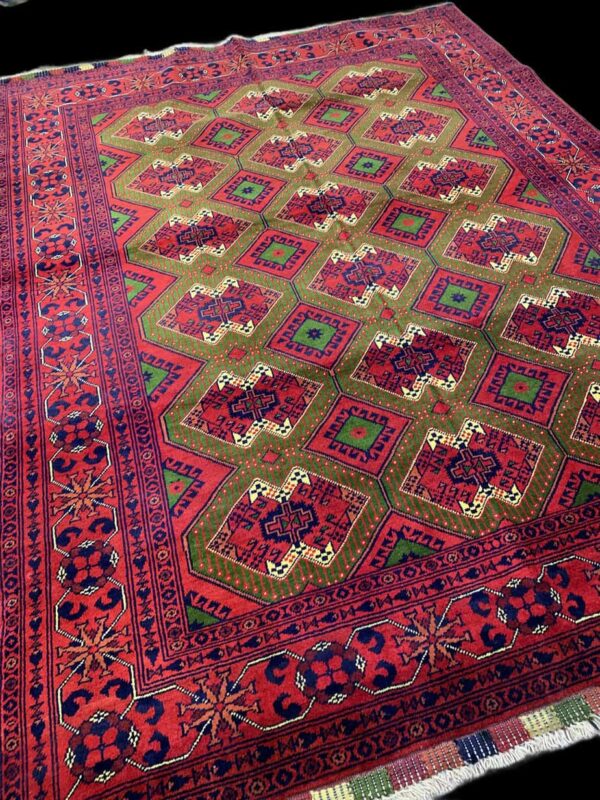 Vintage Persian rug featuring intricate geometric patterns in vibrant red, green, and blue hues, showcasing traditional craftsmanship and detailed design.