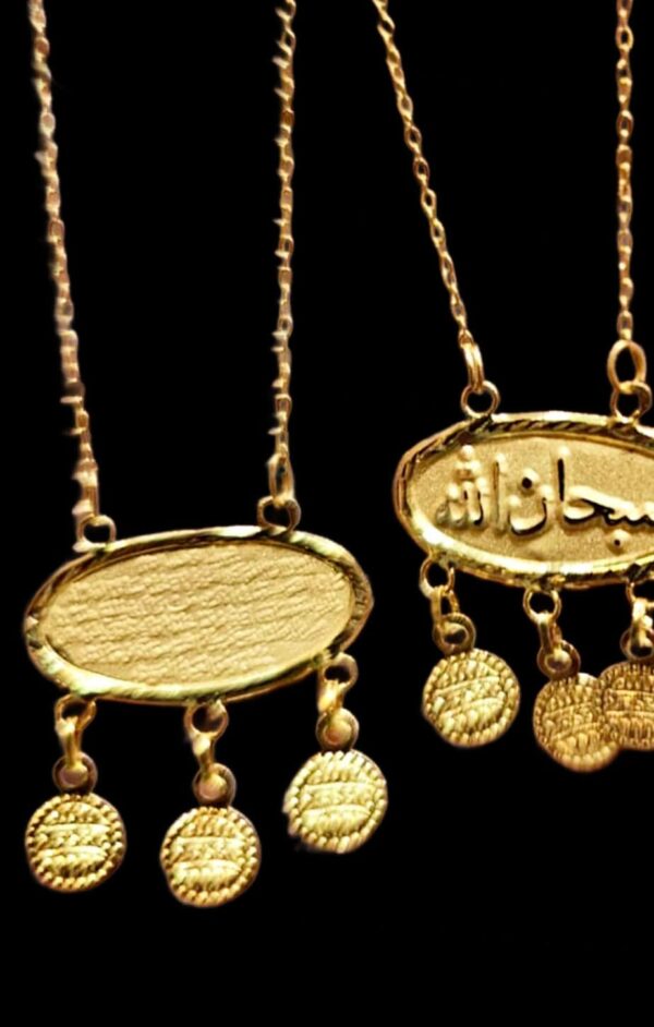 Gold pendant necklaces with coin charms and Arabic inscriptions, elegant jewellery for women.