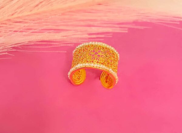Beautiful gold cuff bracelet with intricate design, perfect for stylish women and special occasions. Crafted with detailed patterns and a polished finish.