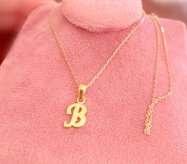 letter necklace in gold with gold chain