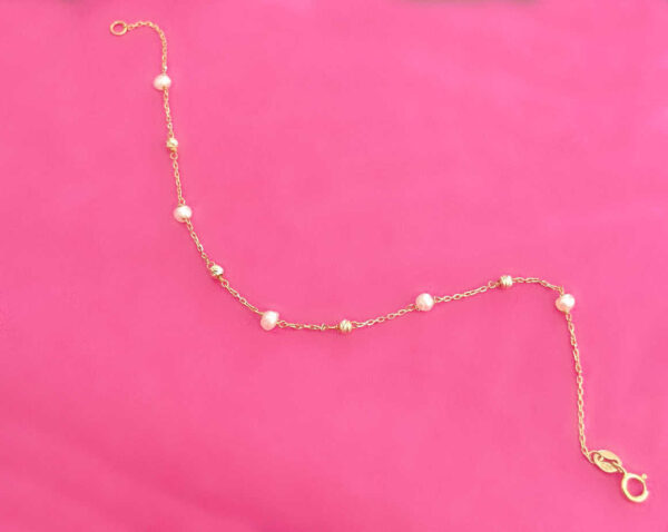 Pearl chain necklace with gold links and clasp, perfect for elegant and casual outfits. Ideal for gifting or personal jewellery collection.