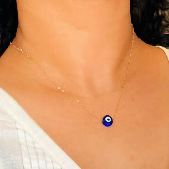 Evil Eye pendant necklace on a gold necklace