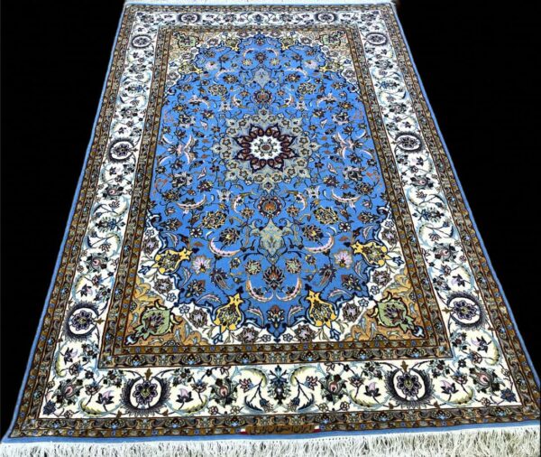 Beautiful Persian rug featuring intricate floral patterns in shades of blue, white, and gold, perfect for enhancing home decor.