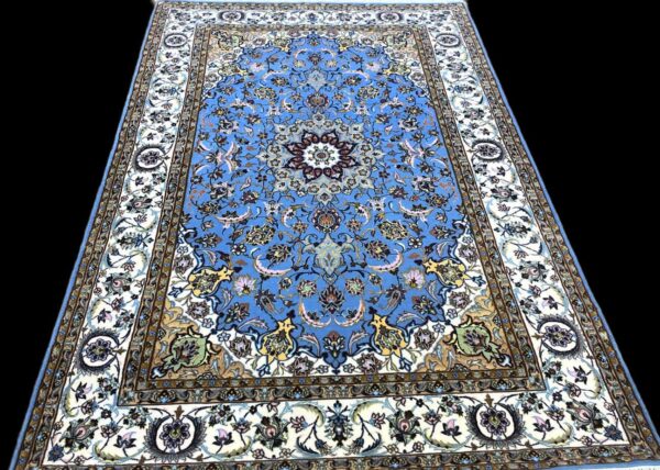 Beautiful blue Persian rug featuring intricate floral and vine designs, perfect for enhancing living rooms or bedrooms with traditional decor.