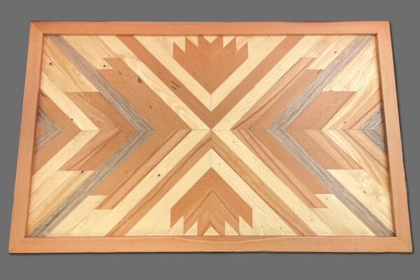 Wooden geometric patterned table with inlay design, showcasing craftsmanship and natural wood tones for home decor or furniture accents.