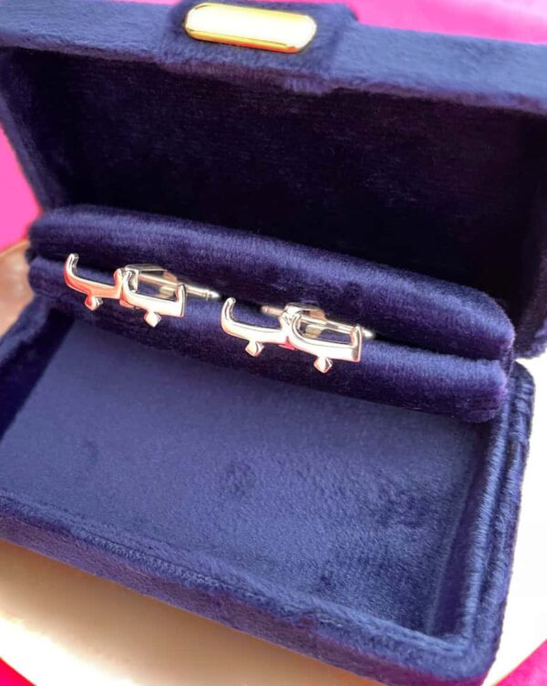 Cufflinks in a velvet box, ideal for men's formal accessories, showcasing a sleek and polished design.