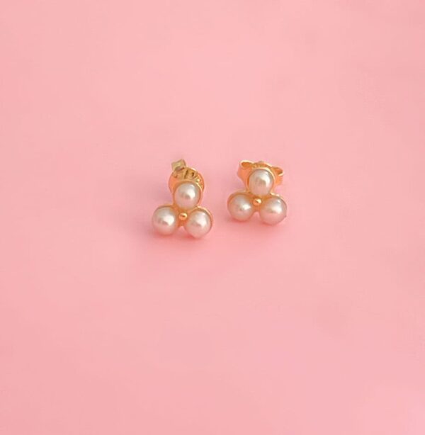 Elegant pearl cluster earrings with gold settings, perfect for special occasions and everyday wear.
