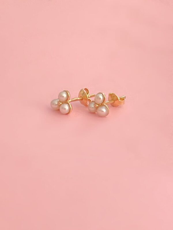 Pair of gold stud earrings with white pearls, perfect for elegant occasions and everyday wear, showcasing timeless jewellery design.