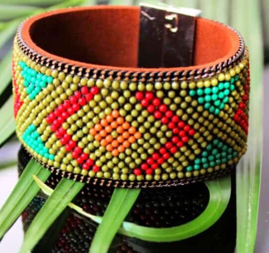 Vibrant beaded tribal bracelet with colorful geometric patterns, handmade jewellery perfect for ethnic and bohemian styles.