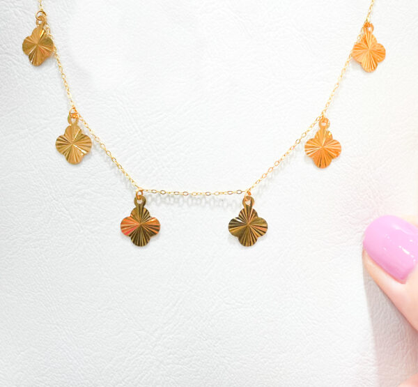 gold clover necklace.