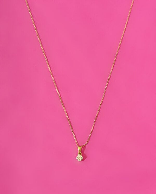 Gold necklace with a single Diamond