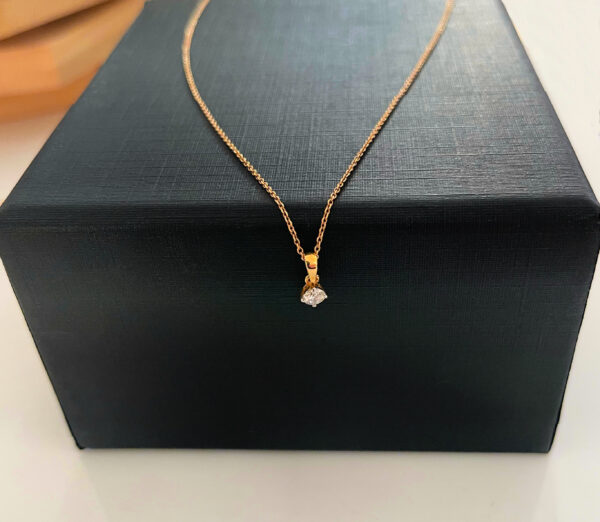 Diamond pendant necklace on gold chain