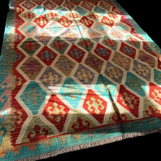 Multicoloured traditional woven rug with geometric patterns, ideal for home décor and oriental interior design, featured on Souq2Door.