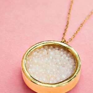A gold pendant with natural pearls from Bahrain