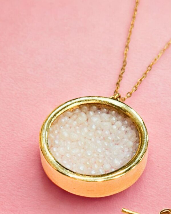 A gold pendant with natural pearls from Bahrain
