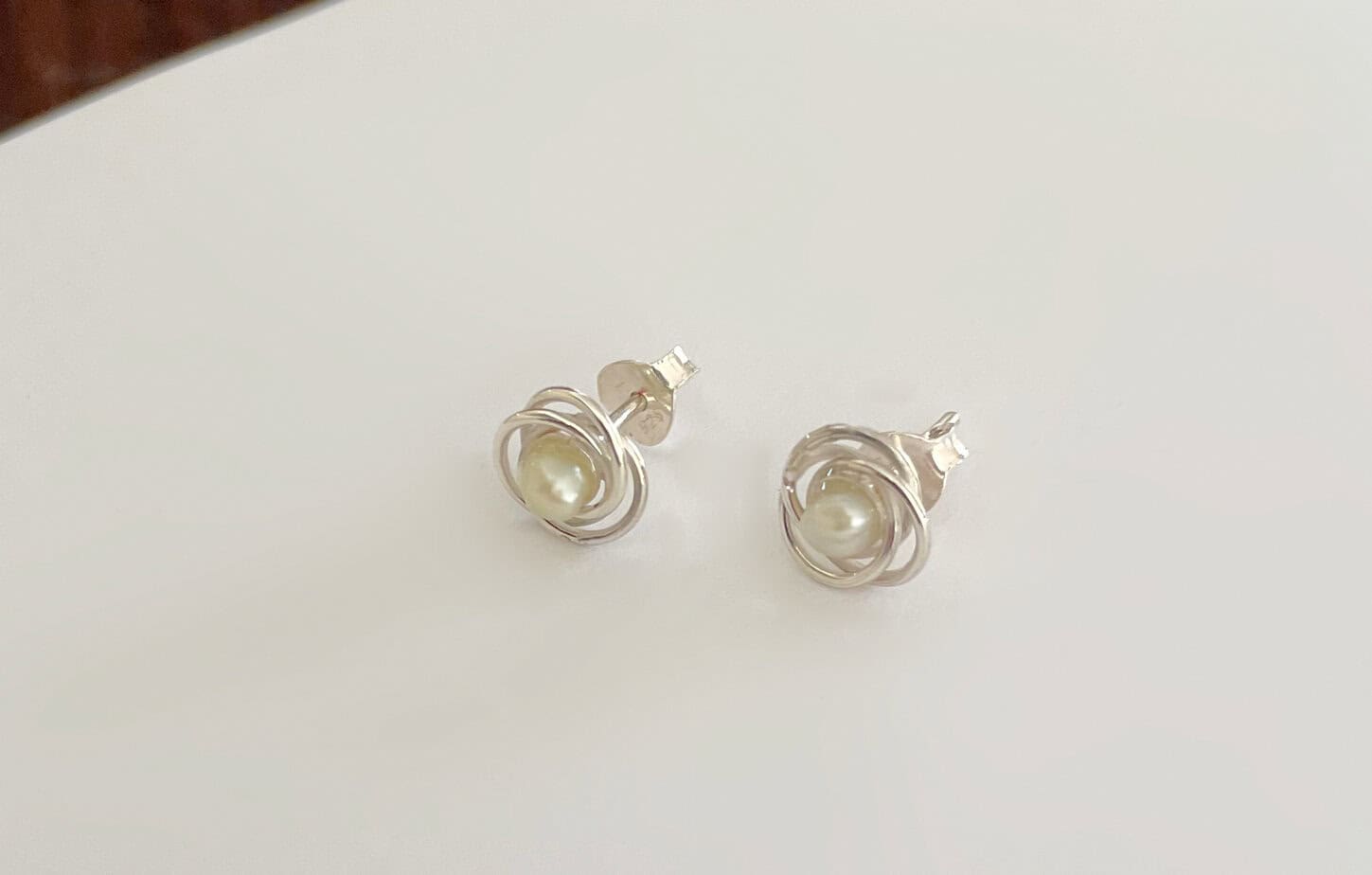 Pearl and silver rose stud earrings on white background, perfect for elegant jewellery collections and gift ideas, high-quality accessories from Souq2Door.