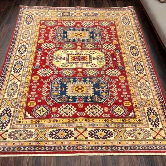 Vibrant oriental rug from Afghanistan featuring intricate geometric patterns in red, yellow, and blue, ideal for enhancing living room or bedroom aesthetics with a touch of cultural elegance.