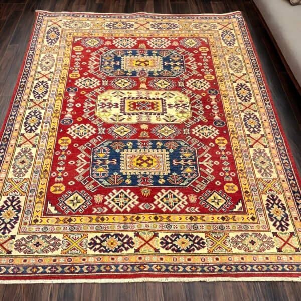 Vibrant oriental rug from Afghanistan featuring intricate geometric patterns in red, yellow, and blue, ideal for enhancing living room or bedroom aesthetics with a touch of cultural elegance.