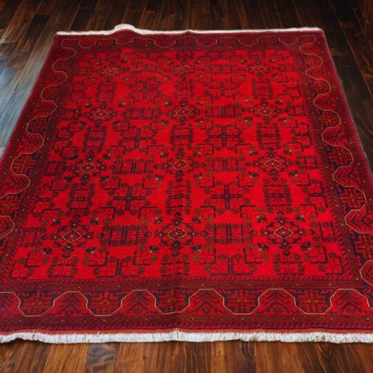 Rich red traditional hand-knotted wool rug from Afghanistan featuring intricate geometric patterns, floral motifs, and a decorative border. Perfect for enhancing the style of living rooms, lounges, or ethnic home decor.
