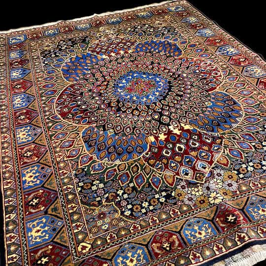 Intricately designed Persian rug featuring detailed patterns and rich colours including blue, red, and gold, perfect for enhancing home decor; made from high-quality materials and handcrafted.